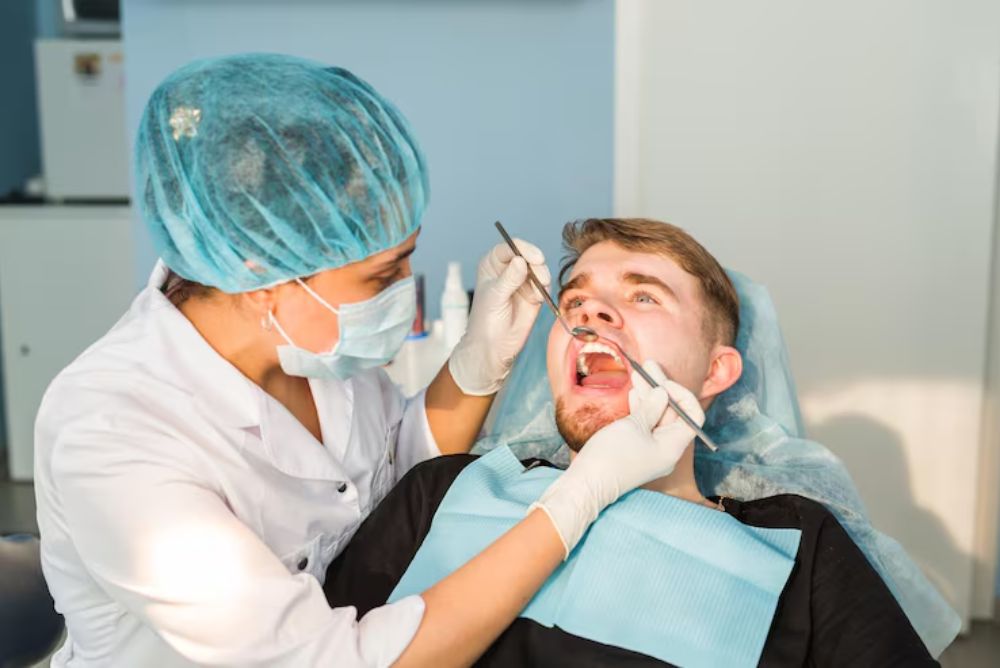 dentist treating an athlete with a sports related dental injury